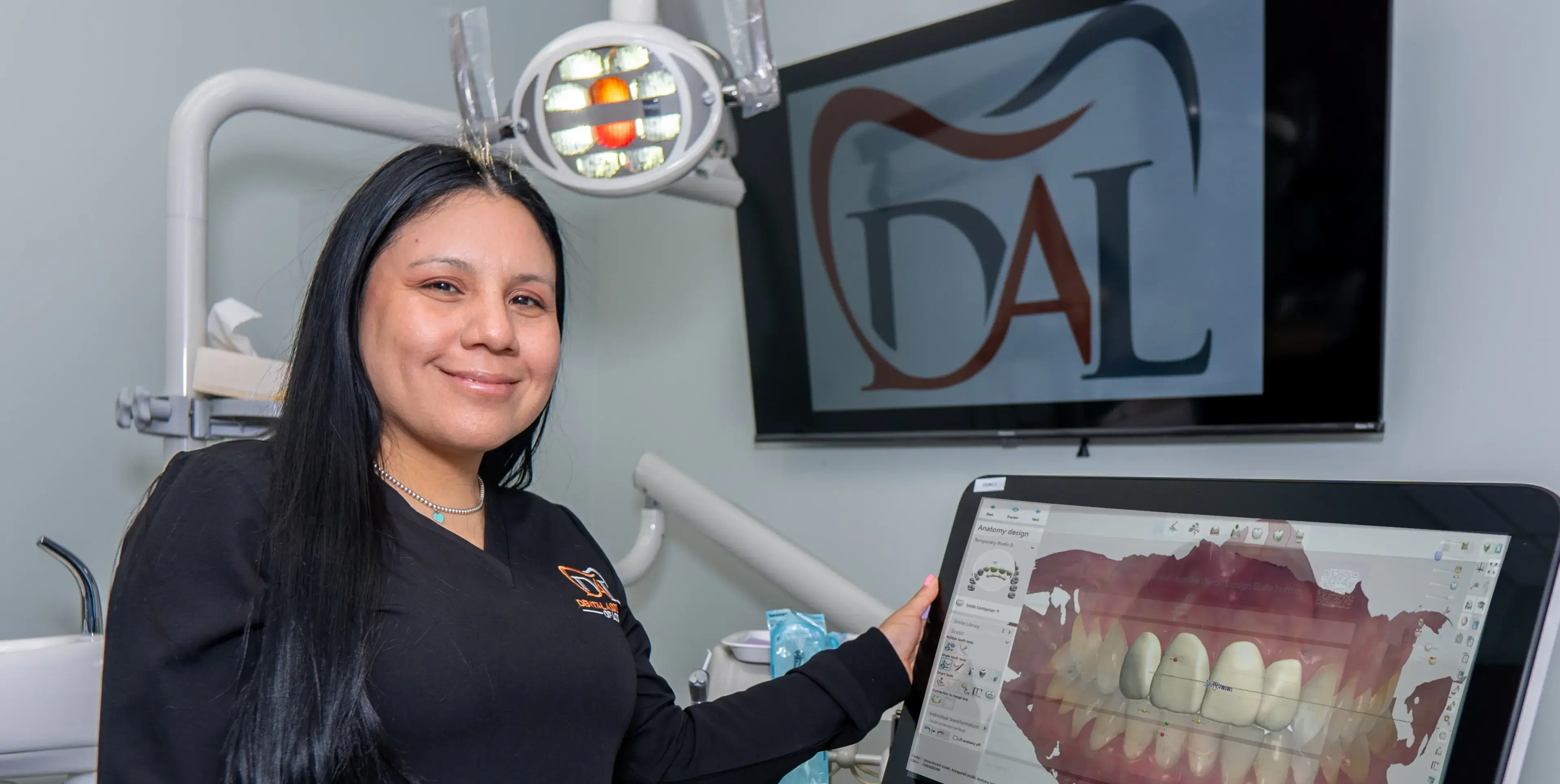 A team member demonstrates a digital dental scan in our office.